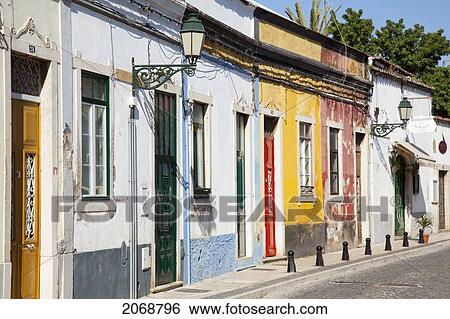 Weathered Colourful Painted Buildings Along A Street; Faro Algarve Portugal View Large Photo Image Stock Photograph - Weathered Colourful Painted Buildings Along A Street; Faro Algarve Portugal. Fotosearch