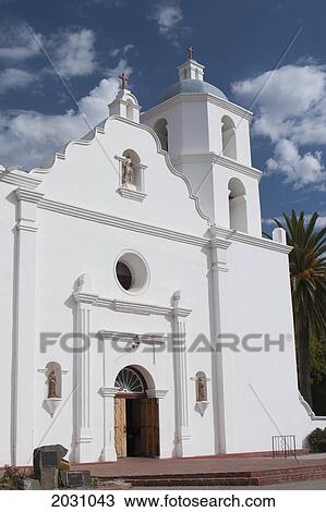 Stock Image - White Church Entrance With Steeple And Blue Sky And Clouds; Oceanside California United States Of America. Fotosearch