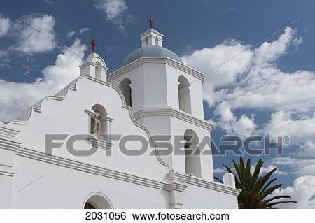 Stock Photograph - White Church Steeple With Blue Sky And Clouds; Oceanside California United States Of America. Fotosearch