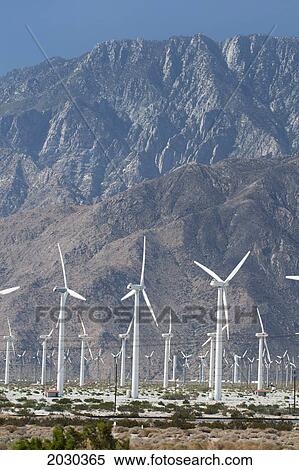 Windmill Farm With Desert Mountain In The Distance And Blue Sky; Palm Springs California United States Of America View Large Photo Image Stock Photography - Windmill Farm With Desert Mountain In The Distance And Blue Sky; Palm Springs California United States Of America. Fotosearch