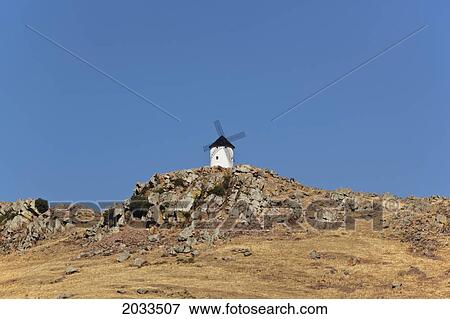 Windmill On A Hill; Fuente El Fresno Ciudad Real Province La Mancha Spain View Large Photo Image Stock Photo - Windmill On A Hill; Fuente El Fresno Ciudad Real Province La Mancha Spain. Fotosearch