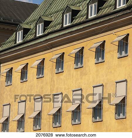 Stock Photo - Windows open along the side of a building; stockholm sweden. Fotosearch