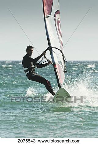Stock Image - Windsurfing; Tarifa Cadiz Andalusia Spain. Fotosearch