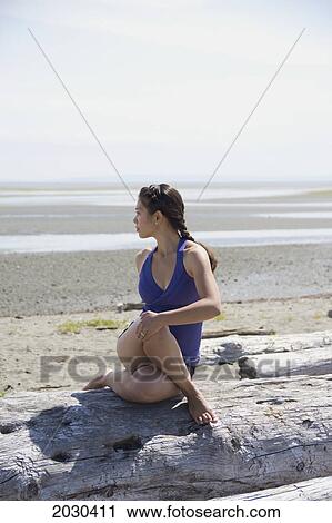Woman In Exercise Wear Stretching On The Beach; Delta British Columbia Canada View Large Photo Image Stock Image - Woman In Exercise Wear Stretching On The Beach; Delta British Columbia Canada. Fotosearch
