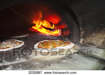 Wood-Fired Oven With Traditional Italian Pizzas Ready To Be Baked; Coolangatta Queensland Australia View Large Photo Image Stock Photo - Wood-Fired Oven With Traditional Italian Pizzas Ready To Be Baked; Coolangatta Queensland Australia. Fotosearch