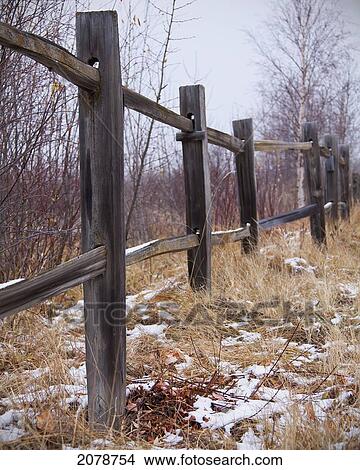 Wooden fence bordering nature sanctuary; parkland county alberta canada View Large Photo Image Picture - Wooden fence bordering nature sanctuary; parkland county alberta canada. Fotosearch