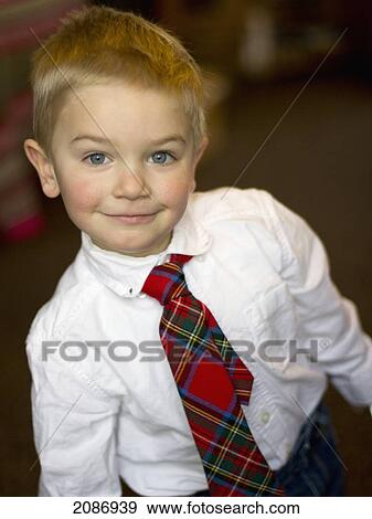 Young boy in a white shirt and tartan tie; cambridge united kingdom View Large Photo Image Stock Photo - Young boy in a white shirt and tartan tie; cambridge united kingdom. Fotosearch