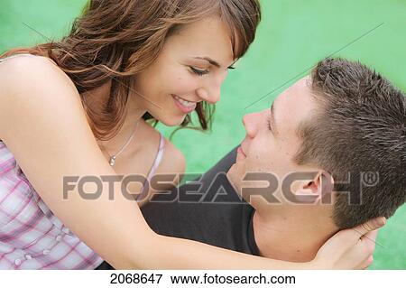 Young Couple Looking At Each Other; Troutdale Oregon United States Of America View Large Photo Image Stock Photo - Young Couple Looking At Each Other; Troutdale Oregon United States Of America. Fotosearch
