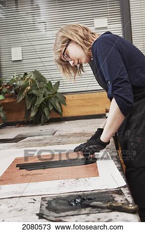 Young female art student creating prints in studio; edmonton alberta canada View Large Photo Image Stock Image - Young female art student creating prints in studio; edmonton alberta canada. Fotosearch
