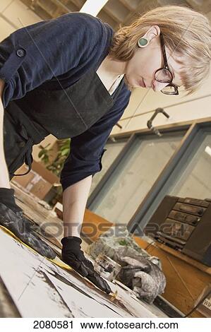 Young female art student creating prints in studio; edmonton alberta canada View Large Photo Image Stock Image - Young female art student creating prints in studio; edmonton alberta canada. Fotosearch