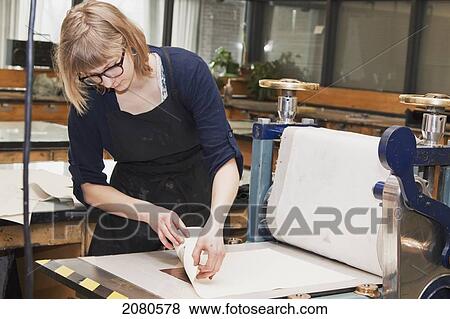 Young female art student creating prints in studio; edmonton alberta canada View Large Photo Image Stock Photo - Young female art student creating prints in studio; edmonton alberta canada. Fotosearch