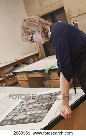 Young female art student creating prints in studio; edmonton alberta canada View Large Photo Image Stock Photography - Young female art student creating prints in studio; edmonton alberta canada. Fotosearch