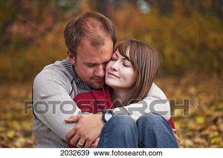 Young Married Couple Embracing Intimately In A Park In Autumn; Edmonton Alberta Canada View Large Photo Image Stock Photo - Young Married Couple Embracing Intimately In A Park In Autumn; Edmonton Alberta Canada. Fotosearch