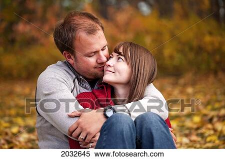 Young Married Couple Embracing Intimately In A Park In Autumn; Edmonton Alberta Canada View Large Photo Image Stock Photography - Young Married Couple Embracing Intimately In A Park In Autumn; Edmonton Alberta Canada. Fotosearch