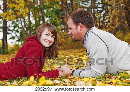Young Married Couple Spending Quality Time Together In A Park In Autumn; Edmonton Alberta Canada View Large Photo Image Stock Photo - Young Married Couple Spending Quality Time Together In A Park In Autumn; Edmonton Alberta Canada. Fotosearch