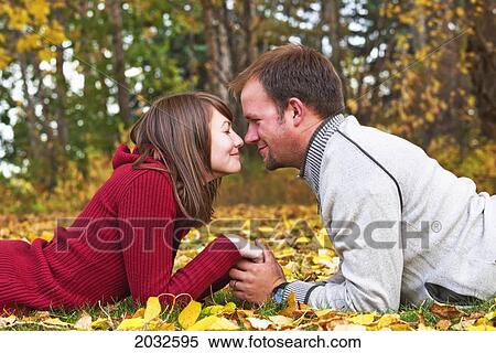 Young Married Couple Spending Quality Time Together In A Park In Autumn; Edmonton Alberta Canada View Large Photo Image Stock Photography - Young Married Couple Spending Quality Time Together In A Park In Autumn; Edmonton Alberta Canada. Fotosearch