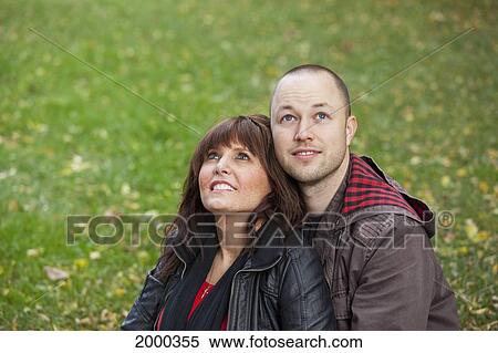 Stock Photography - Young Newlywed Couple In A Park Together; Edmonton Alberta Canada. Fotosearch