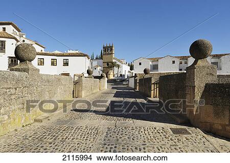 16th century puente viejo (old bridge) entrance to the old city; ronda malaga spain View Large Photo Image Picture - 16th century puente viejo (old bridge) entrance to the old city; ronda malaga spain. Fotosearch