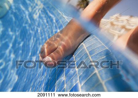 A bare foot dipping into the pool; tarifa, cadiz, andalusia, spain View Large Photo Image Stock Image - A bare foot dipping into the pool; tarifa, cadiz, andalusia, spain. Fotosearch