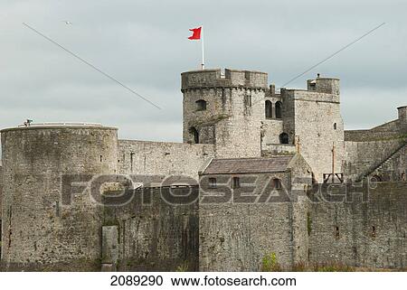 A castle with a red flag flying on a tower; ireland View Large Photo Image Stock Image - A castle with a red flag flying on a tower; ireland. Fotosearch