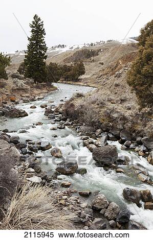 A creek running through yellowstone national park with traces of snow; wyoming united states of america View Large Photo Image Stock Photography - A creek running through yellowstone national park with traces of snow; wyoming united states of america. Fotosearch