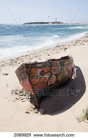 A hand painted wooden boat on zahora beach; andalusia, spain View Large Photo Image Stock Photo - A hand painted wooden boat on zahora beach; andalusia, spain. Fotosearch