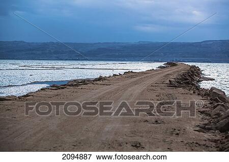 Stock Photo - A road crossing the dead sea; israel. Fotosearch
