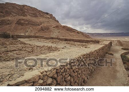 Stock Image - A stone wall in a roman camp; masada southern district israel. Fotosearch