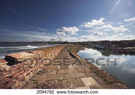 A walkway along the harbour; dunbar, scottish borders, scotland View Large Photo Image Stock Image - A walkway along the harbour; dunbar, scottish borders, scotland. Fotosearch