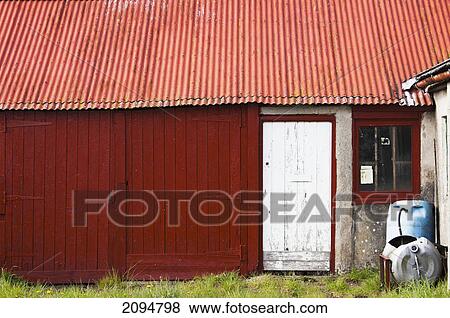 A white door on a red building; northumberland, england View Large Photo Image Stock Photo - A white door on a red building; northumberland, england. Fotosearch