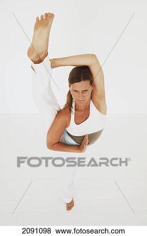 A woman in a yoga pose; tarifa, cadiz, andalusia, spain View Large Photo Image Stock Photo - A woman in a yoga pose; tarifa, cadiz, andalusia, spain. Fotosearch