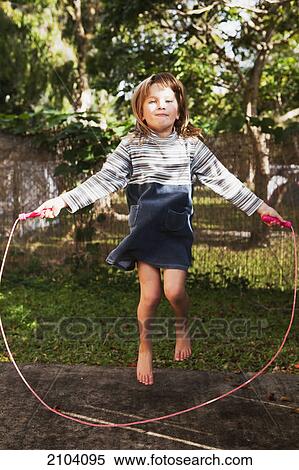 A young girl jumping rope; gold coast queensland australia View Large Photo Image Stock Photography - A young girl jumping rope; gold coast queensland australia. Fotosearch