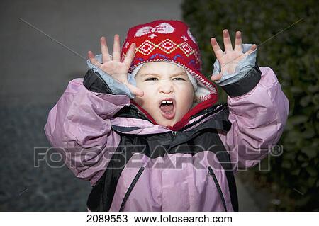 A young girl making a roaring face and gesture; beijing, chine View Large Photo Image Stock Image - A young girl making a roaring face and gesture; beijing, chine. Fotosearch