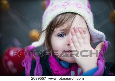 A young girl with one eye covered; beijing, china View Large Photo Image Stock Photo - A young girl with one eye covered; beijing, china. Fotosearch