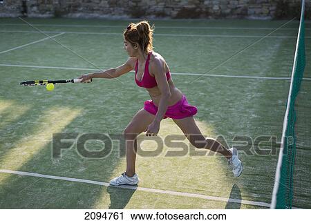 A young woman playing tennis; tarifa, cadiz, andalusia, spain View Large Photo Image Stock Image - A young woman playing tennis; tarifa, cadiz, andalusia, spain. Fotosearch
