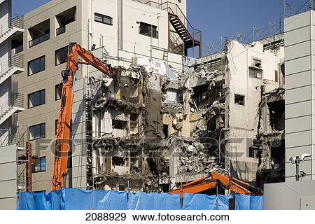 Stock Photo - Apartment building being demolished; tokyo, japan. Fotosearch