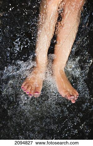 Bare feet getting splashed with water at the currumbin rock pools; gold coast queensland australia View Large Photo Image Stock Photo - Bare feet getting splashed with water at the currumbin rock pools; gold coast queensland australia. Fotosearch
