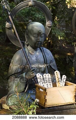 Black buddha with box of prayer tablets in front of a japanese shrine; koyasan, wakayama, japan View Large Photo Image Stock Photo - Black buddha with box of prayer tablets in front of a japanese shrine; koyasan, wakayama, japan. Fotosearch