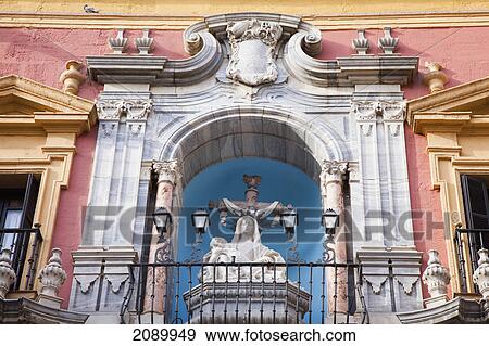 Building with ornate facade and a sculpture with lights on a railing; malaga, andalusia, spain View Large Photo Image Stock Photo - Building with ornate facade and a sculpture with lights on a railing; malaga, andalusia, spain. Fotosearch