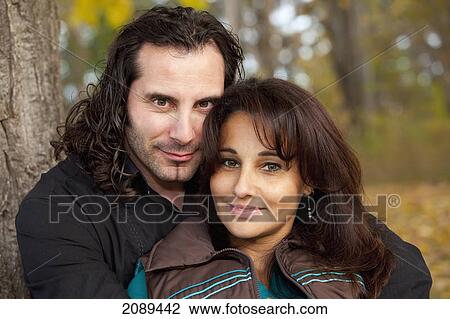 Stock Image - Couple spending quality time together in a park in autumn; edmonton, alberta, canada. Fotosearch