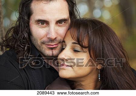 Couple spending quality time together in a park in autumn; edmonton, alberta, canada View Large Photo Image Stock Image - Couple spending quality time together in a park in autumn; edmonton, alberta, canada. Fotosearch