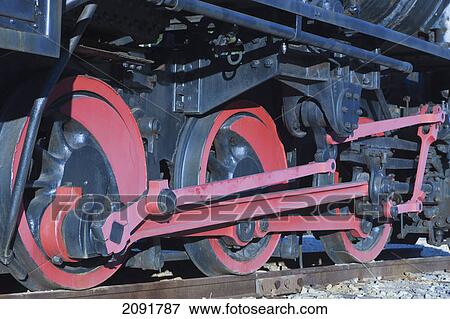 Stock Photo - Detail of wheels and running gear of a steam locomotive set up as monument; minas de rio tinto, huelva province, andalusia, spain. Fotosearch