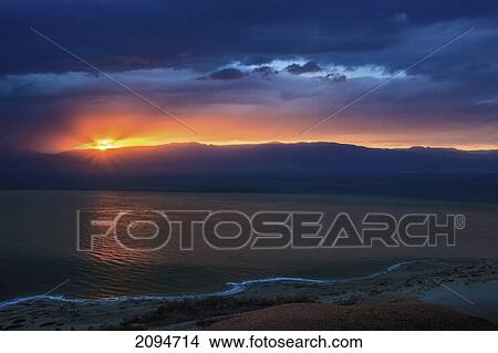 Dramatic sky at sunrise over the dead sea; israel View Large Photo Image Picture - Dramatic sky at sunrise over the dead sea; israel. Fotosearch