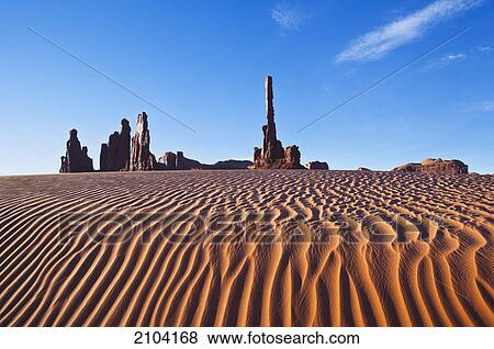 Stock Photo - Early morning sand dunes at totem pole; monument valley arizona united states of america. Fotosearch
