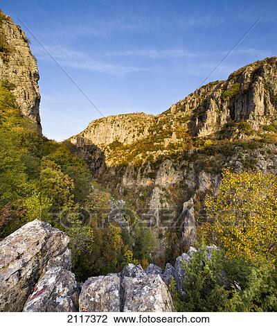 Early morning sun on the mezaria gorge just below the village of kapesovo; epirus greece View Large Photo Image Stock Image - Early morning sun on the mezaria gorge just below the village of kapesovo; epirus greece. Fotosearch