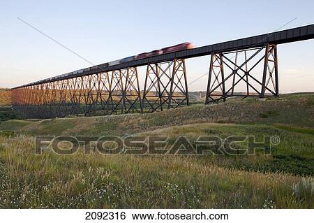 Eastbound train crossing canadian pacific railway's high level bridge on its crowsnest subdivision; lethbridge, alberta, canada View Large Photo Image Stock Photograph - Eastbound train crossing canadian pacific railway's high level bridge on its crowsnest subdivision; lethbridge, alberta, canada. Fotosearch