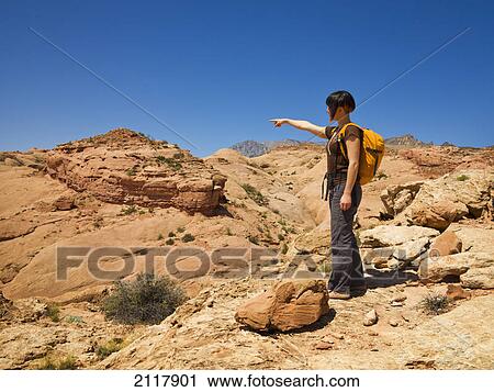 Female hiker exploring utah slot canyons; hanksville utah united states of america View Large Photo Image Stock Image - Female hiker exploring utah slot canyons; hanksville utah united states of america. Fotosearch