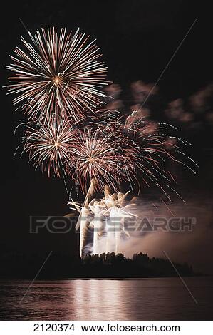 Fireworks displays reflecting off water; calgary alberta canada View Large Photo Image Picture - Fireworks displays reflecting off water; calgary alberta canada. Fotosearch