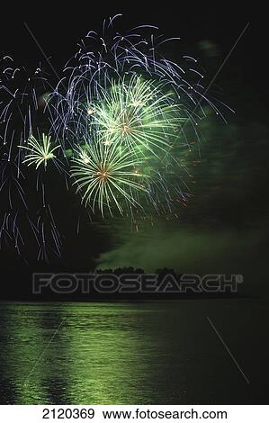 Fireworks displays reflecting off water; calgary alberta canada View Large Photo Image Stock Photo - Fireworks displays reflecting off water; calgary alberta canada. Fotosearch
