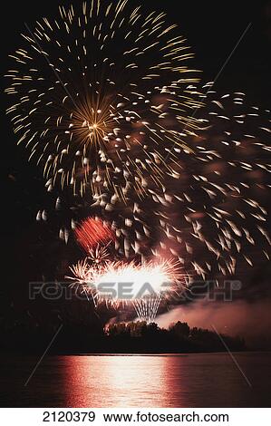 Fireworks displays reflecting off water; calgary alberta canada View Large Photo Image Stock Photo - Fireworks displays reflecting off water; calgary alberta canada. Fotosearch